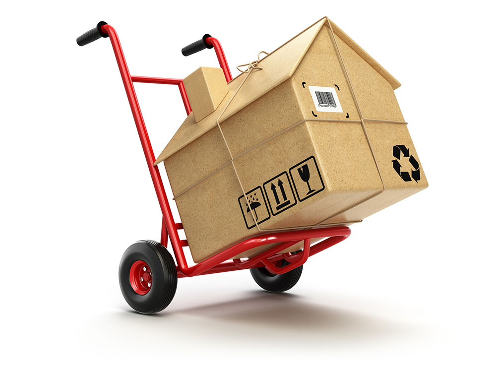 Delivery or moving houseconcept. Hand truck with cardboard box a